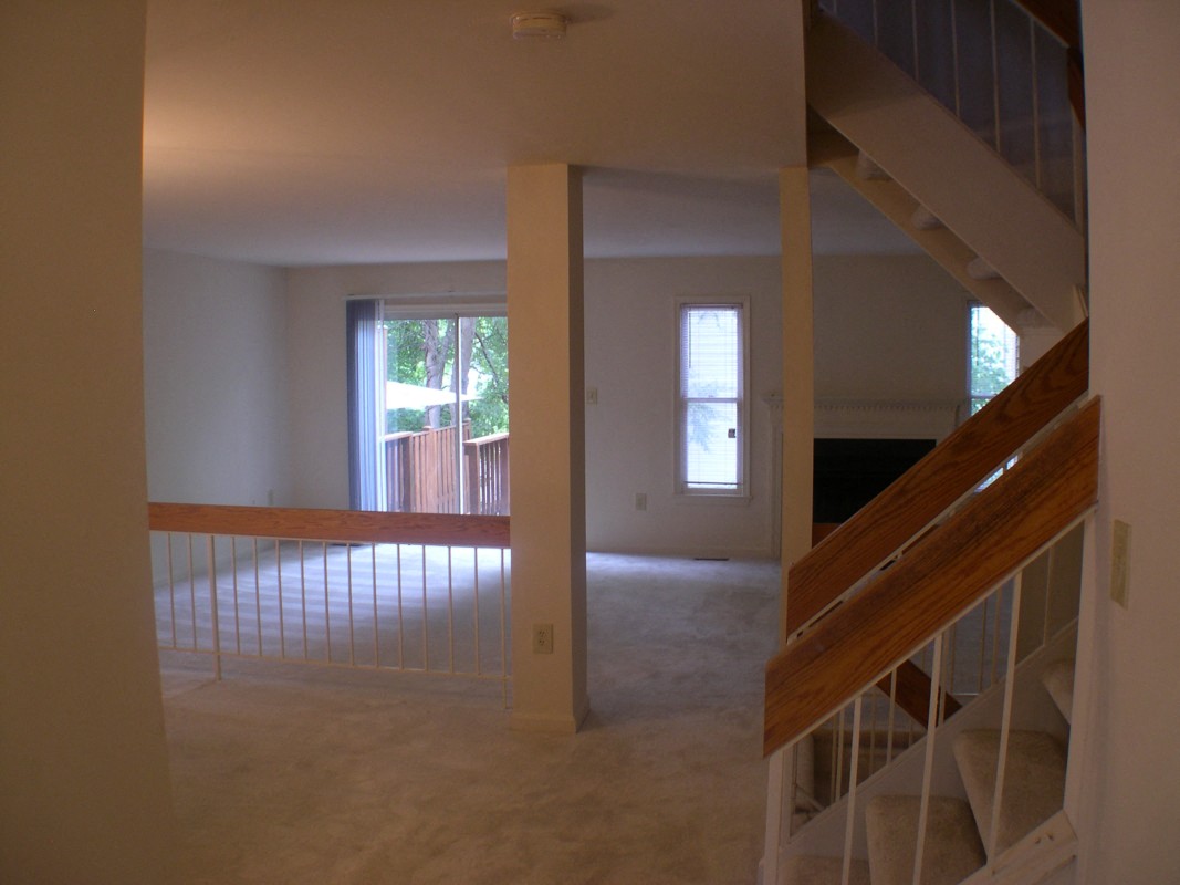 a view of a living room and a staircase in a house